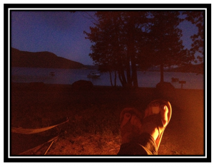 Sitting by the fire, watching the night envelope Lake George. [Yessir... those are my feet (and my poor lil bandaged toes).]